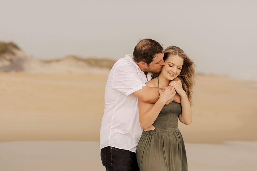 engaged couple on the beach in nags head, nc by sharon elizabeth co