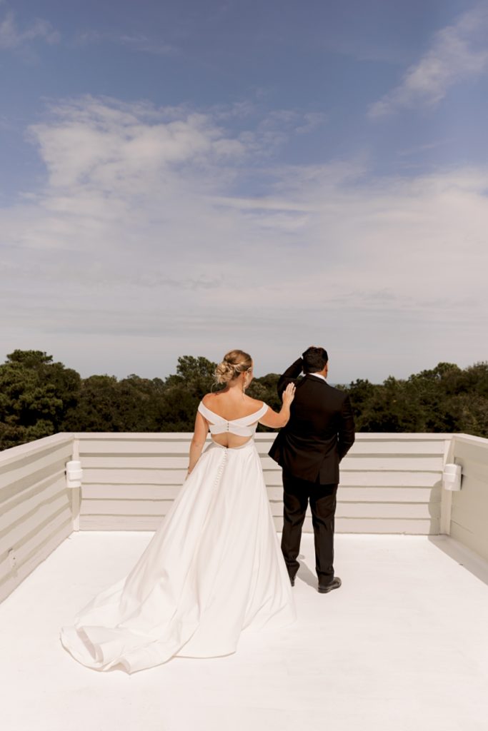 first look on roof of cottage in kitty hawk, nc by sharon elizabeth co