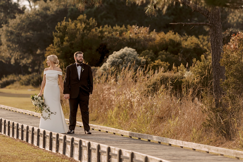 bride and groom on boardwalk