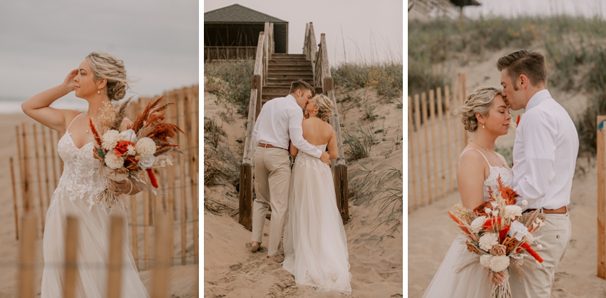 bride stands on dune between wooden fence hugging groom on Kill Devil Hills beach