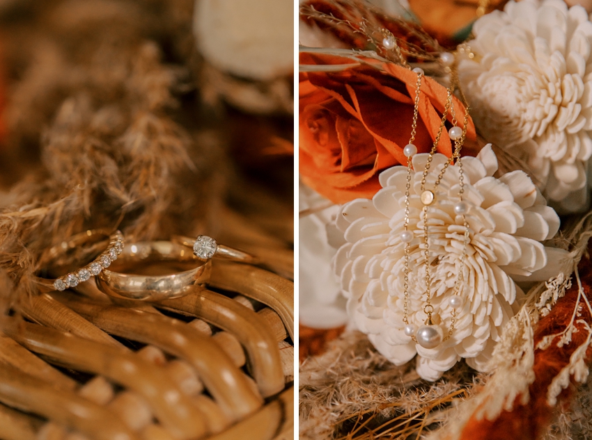 bride's jewelry and white flowers on wicker basket