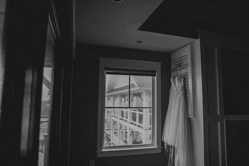 wedding dress hangs inside beach house on Kill Devil Hills