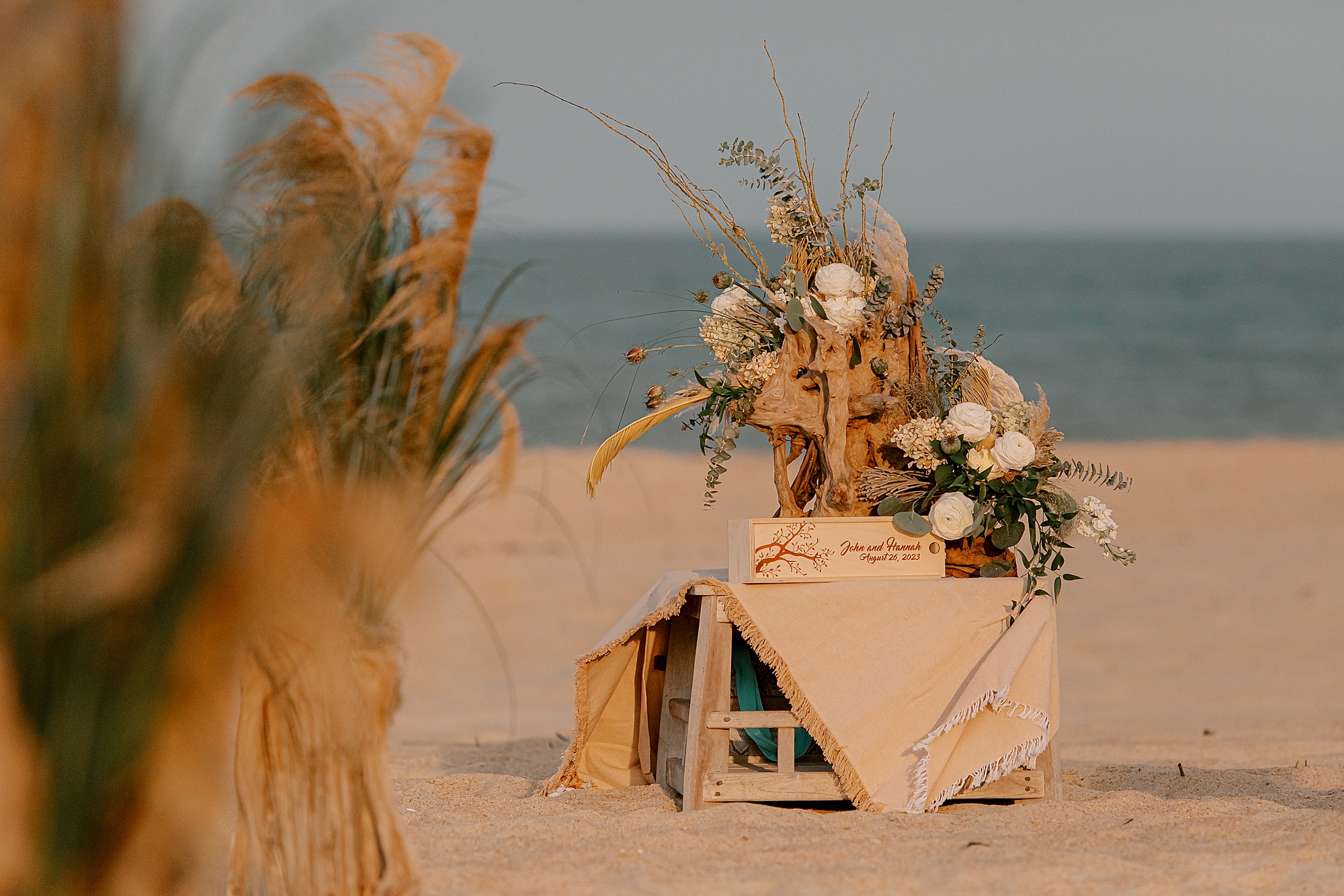 boho inspired ceremony decor on the beach in kill devil hills nc