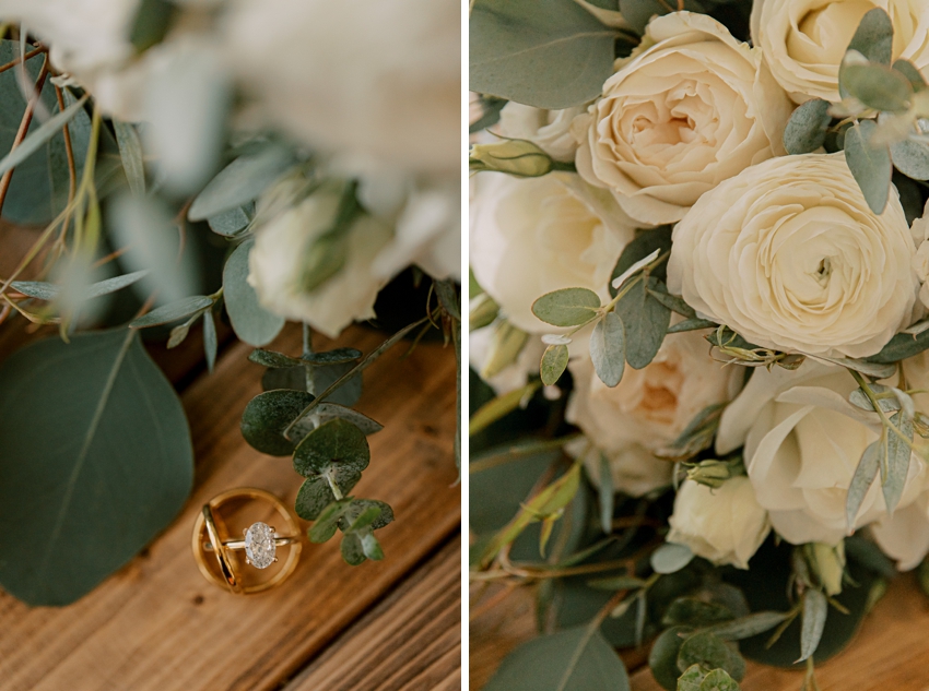 bride's bouquet of white ranunculus and rings on wooden box