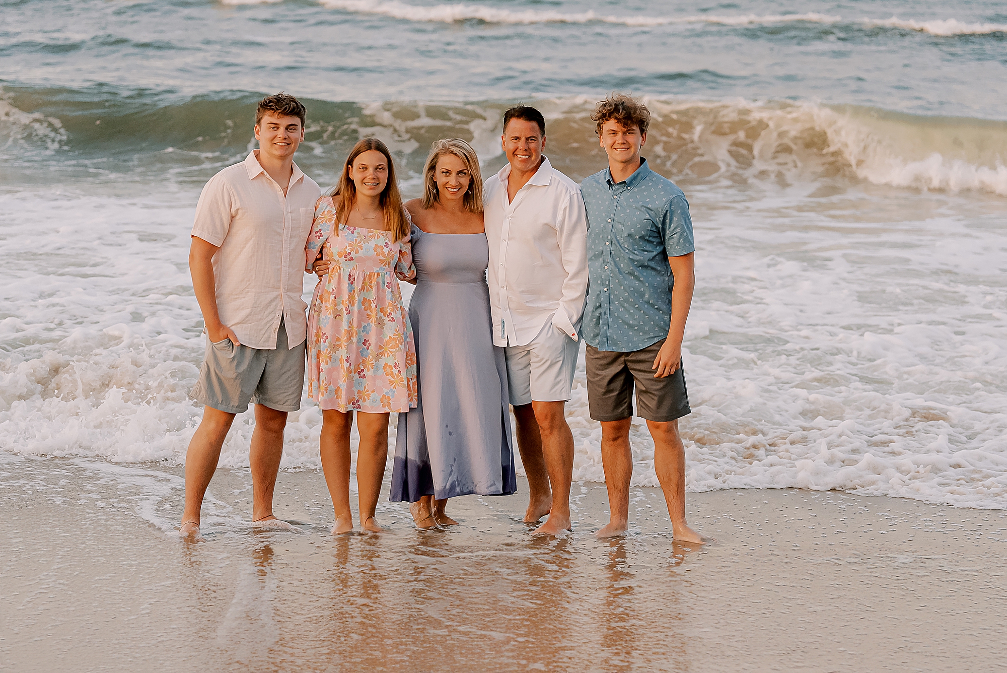 outer banks family photos for family of five standing in surf