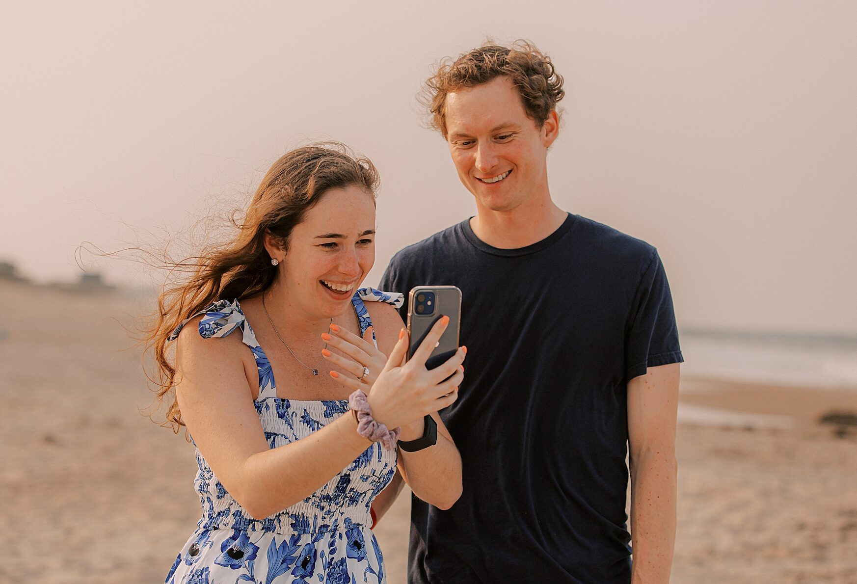 couple makes video call on beach after surprise proposal